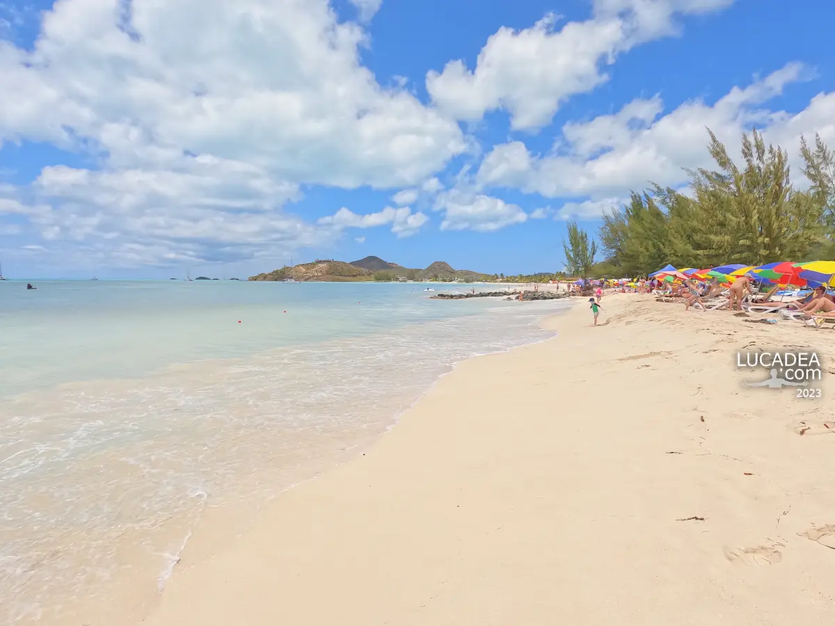 Jolly Beach in Antigua, a long stretch of white sand along Lignum Vitae Bay with resorts behind the shore
