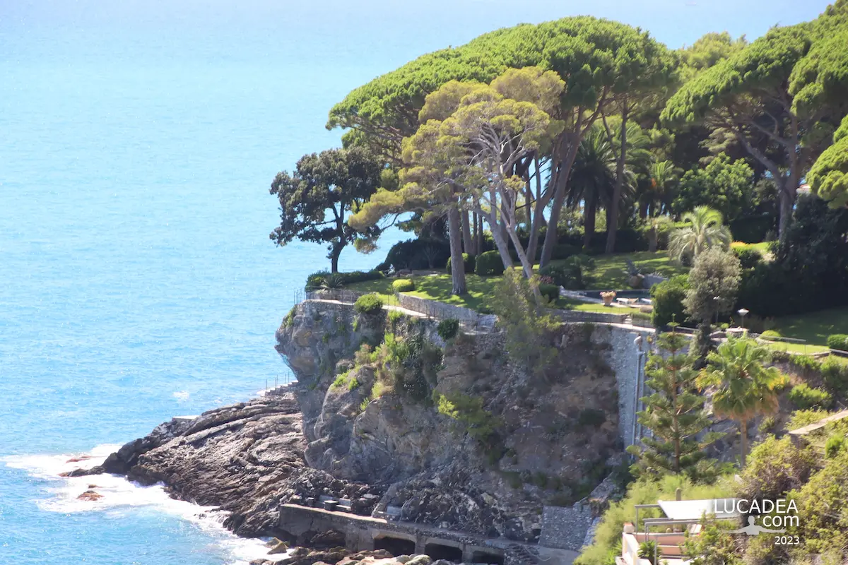 View of Pieve Ligure coast with Scalo Chiappa, rocky shoreline and Mediterranean sea in Liguria