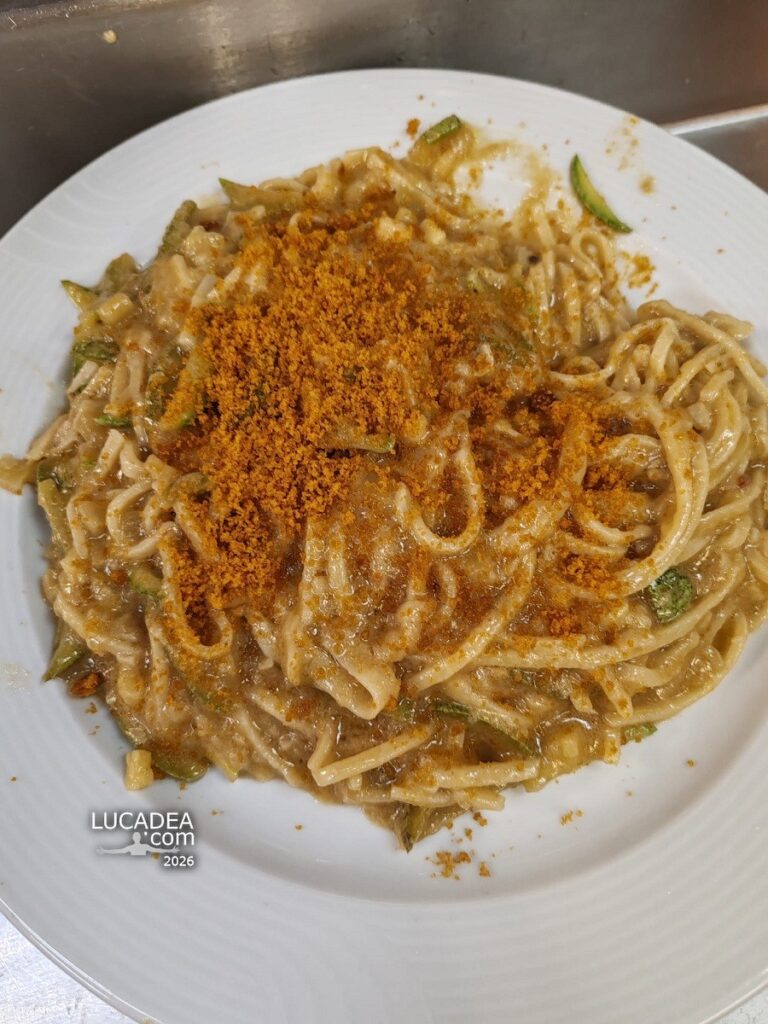 Tagliolini all’uovo con bottarga mantecati con soffritto cremoso di acciughe e spigola